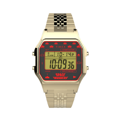 Digital wristwatch with a gold-tone metal band and red-accented display featuring ’Space Invaders’ graphics.
