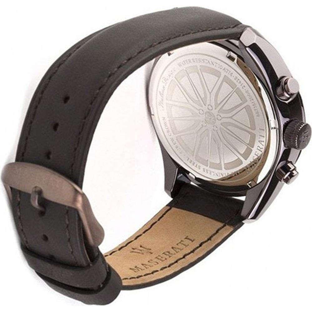 Wristwatch with a black leather strap and silver-toned case.