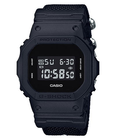 Black digital G-Shock watch with a square face and fabric strap.