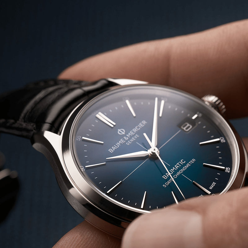 Elegant wristwatch with a dark blue dial and leather strap.