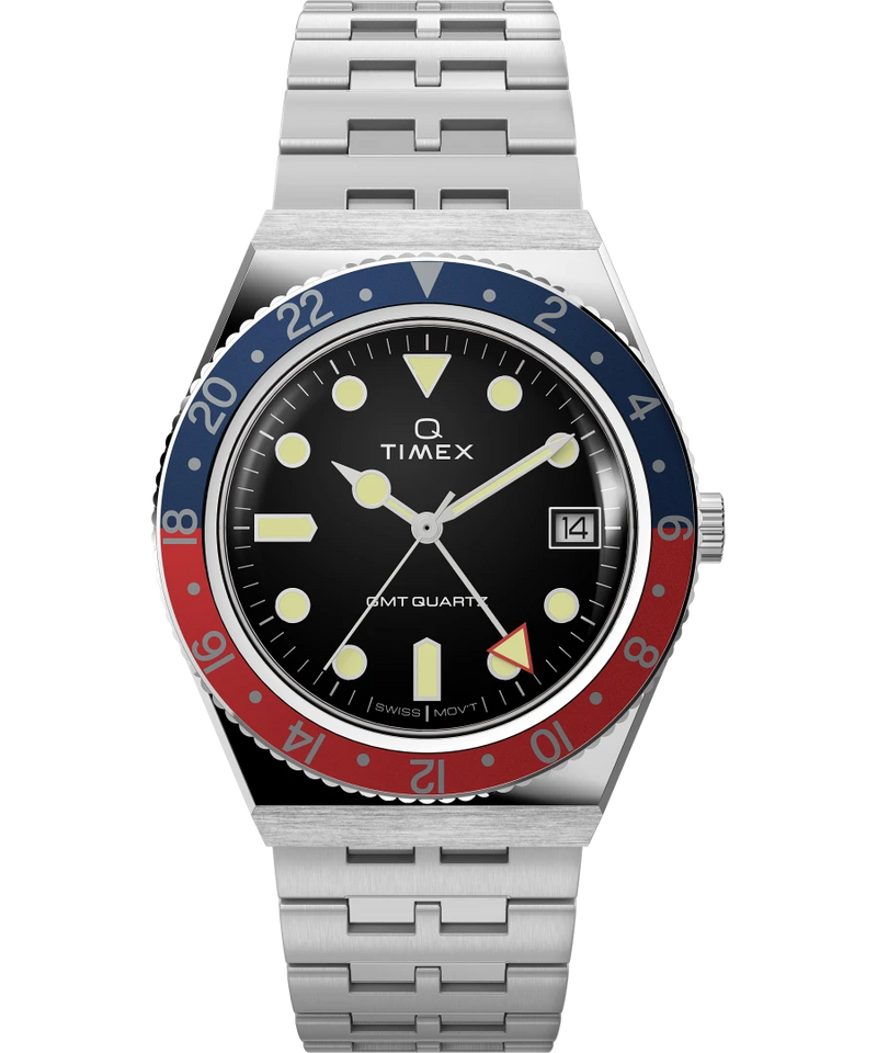 Timex wristwatch with a blue and red bezel, black dial, and stainless steel bracelet.