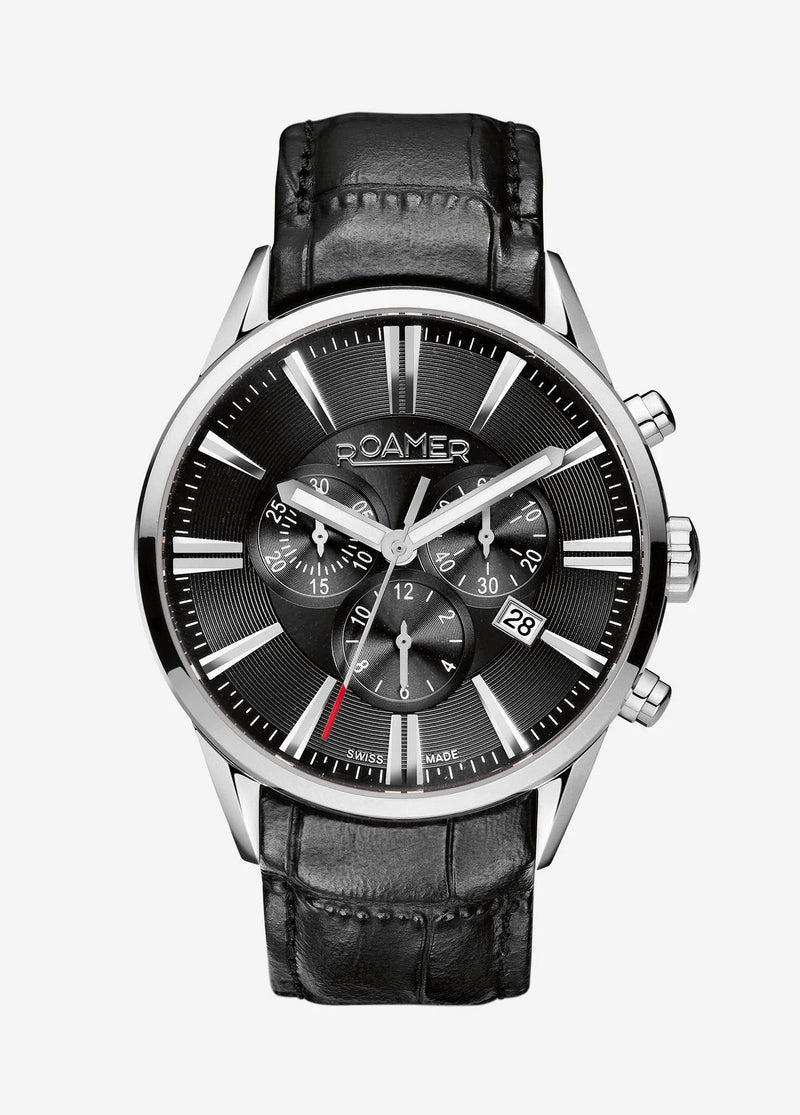 Elegant silver-cased wristwatch with a black dial and leather strap.