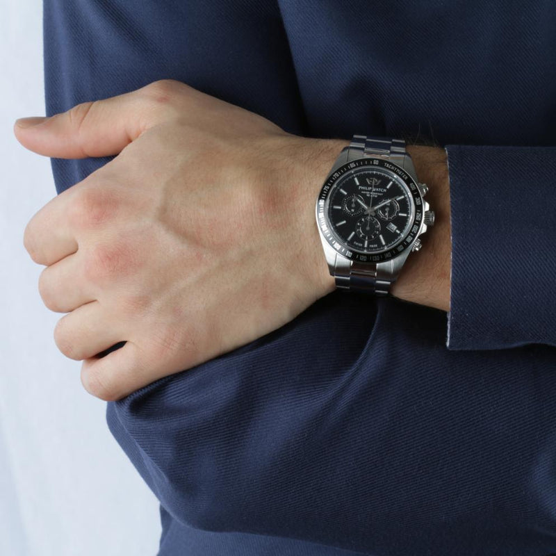 Stainless steel chronograph wristwatch with a black dial.