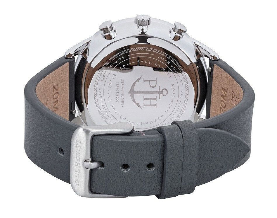Wristwatch with a silver case and gray leather strap.