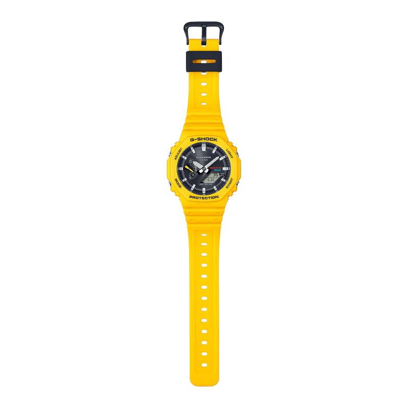 Bright yellow wristwatch with a black dial and digital-analog display.