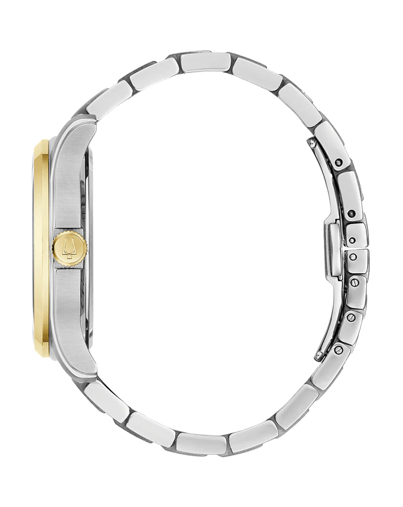 Wristwatch with a silver metal band and gold-colored face.