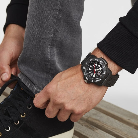 Rugged black wristwatch with a prominent numbered bezel.