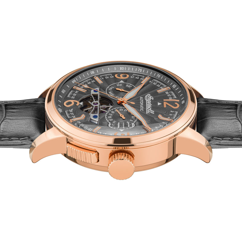 Luxury wristwatch with a rose gold case, black dial, and leather strap.