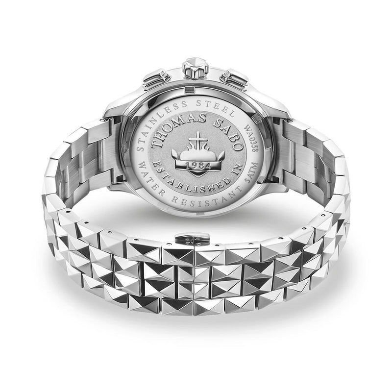 Silver wristwatch with a studded metal bracelet and engraved case back.