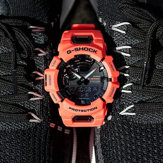 Bright orange G-Shock digital watch with a rugged design.