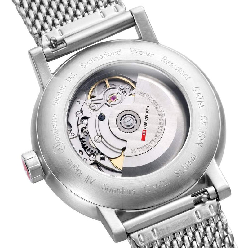 Back of a mechanical wristwatch showing its internal movement through a transparent case.