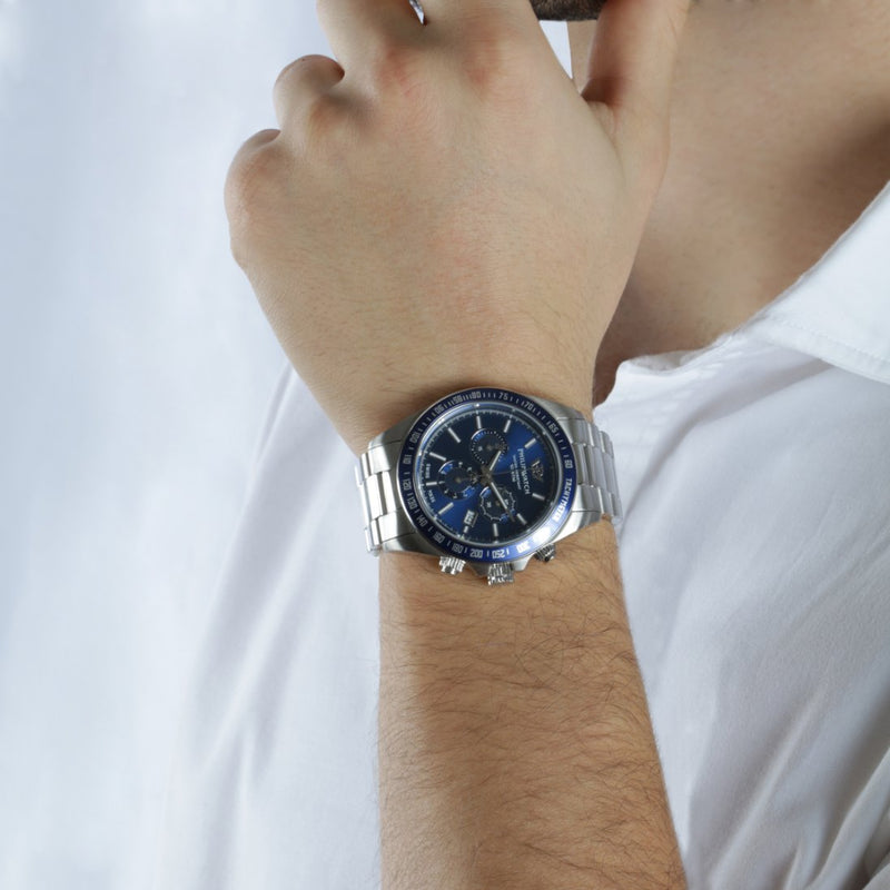 Stylish wristwatch with a blue dial and silver metal bracelet.