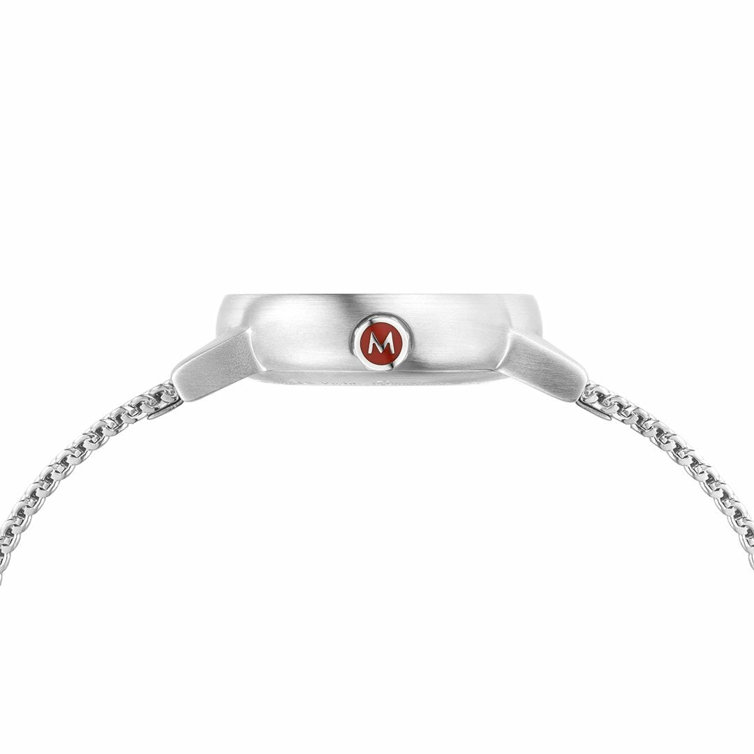Silver wristwatch with a red ’M’ logo on the face and a chain-link bracelet.