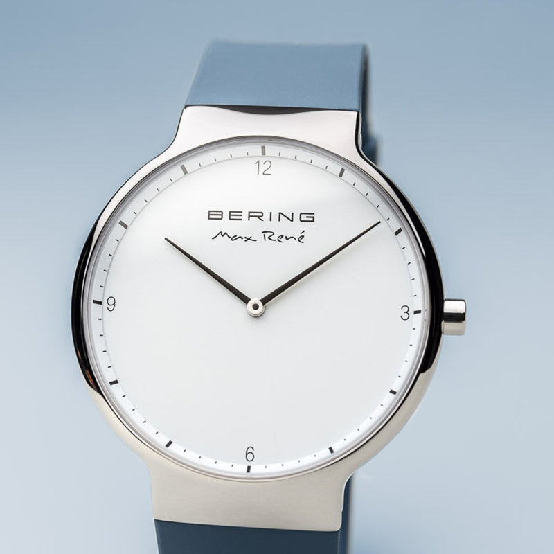 Sleek wristwatch with a minimalist white dial and blue strap.