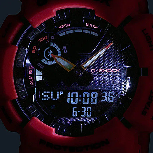 G-Shock digital-analog wristwatch with a red and black color scheme.