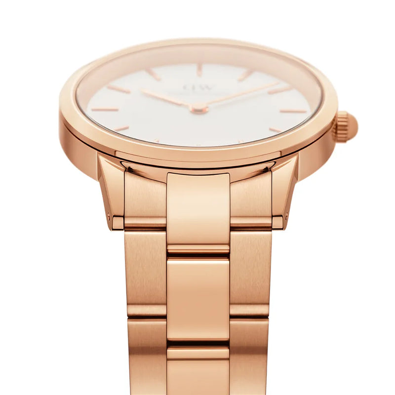 Rose gold wristwatch with a white dial and metal bracelet.