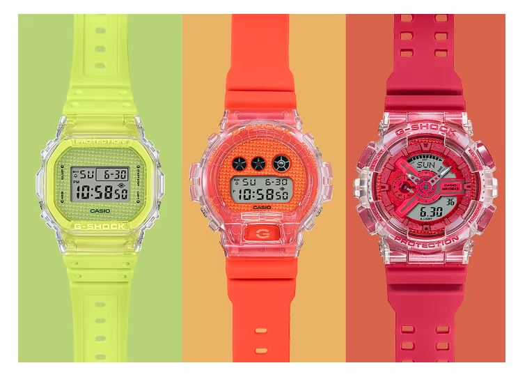 Three colorful digital wristwatches in neon yellow, orange, and pink.