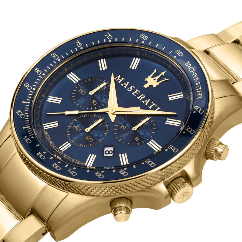 Gold-toned wristwatch with a blue dial featuring chronograph subdials and a tachymeter bezel.