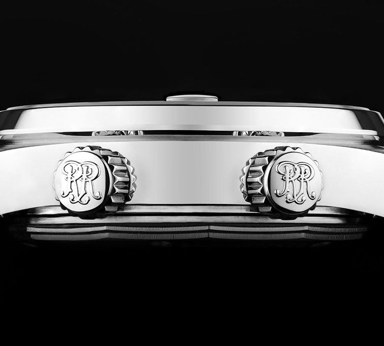 Luxury wristwatch with two crown-like knobs bearing a monogram logo.