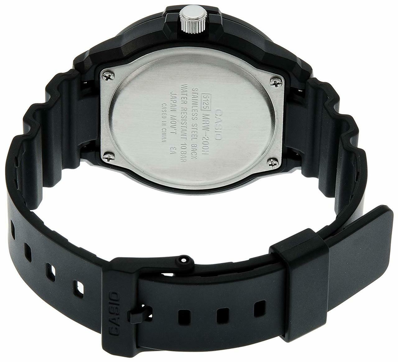 Back of a black wristwatch with a rubber strap.