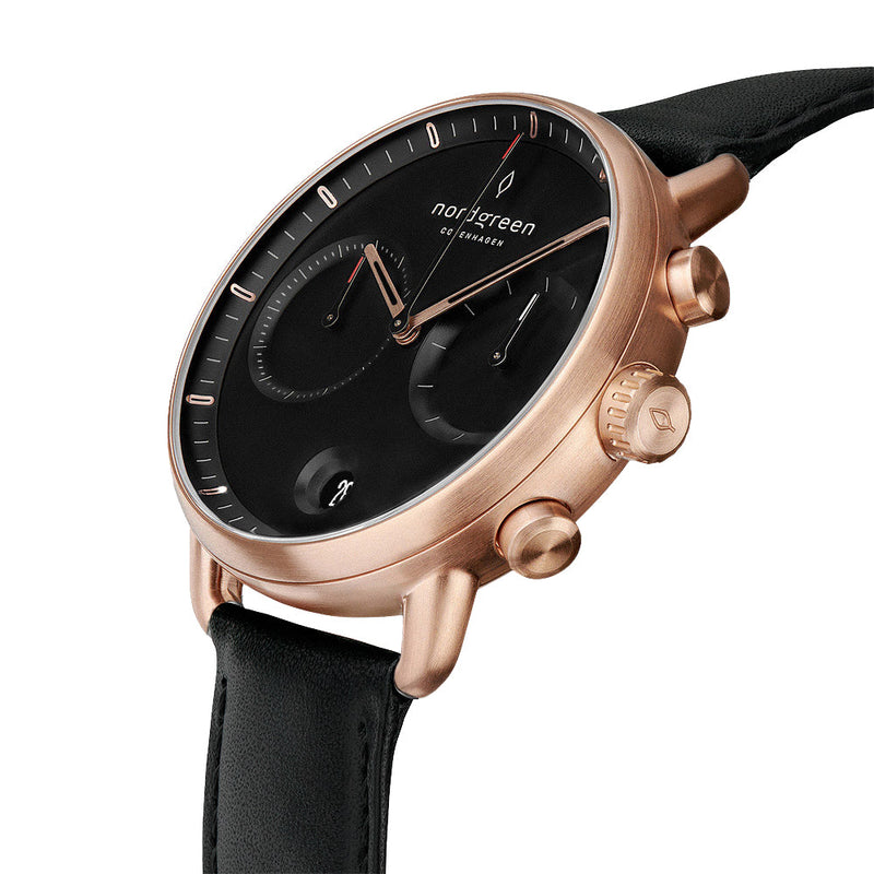 Elegant wristwatch with a rose gold case, black dial, and black leather strap.