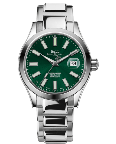 Stainless steel wristwatch with a green dial and date window.