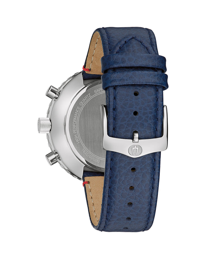 Watch strap and partial watch case with a blue leather band and silver buckle.