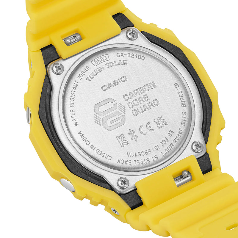 Back of a yellow Casio G-Shock digital watch with visible technical specifications.