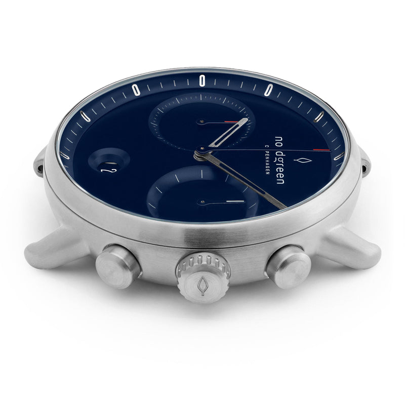 Sleek silver wristwatch with a dark blue dial and multiple subdials.