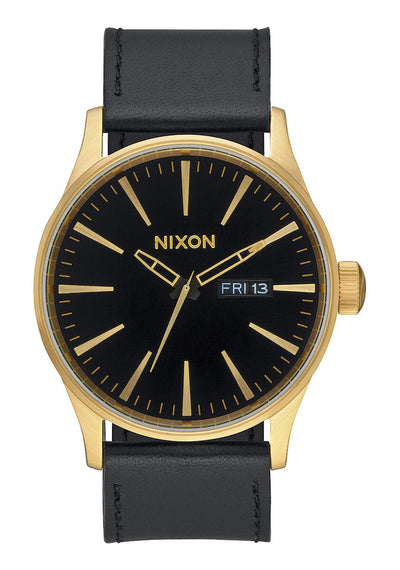 Gold-toned wristwatch with a black face and leather strap.