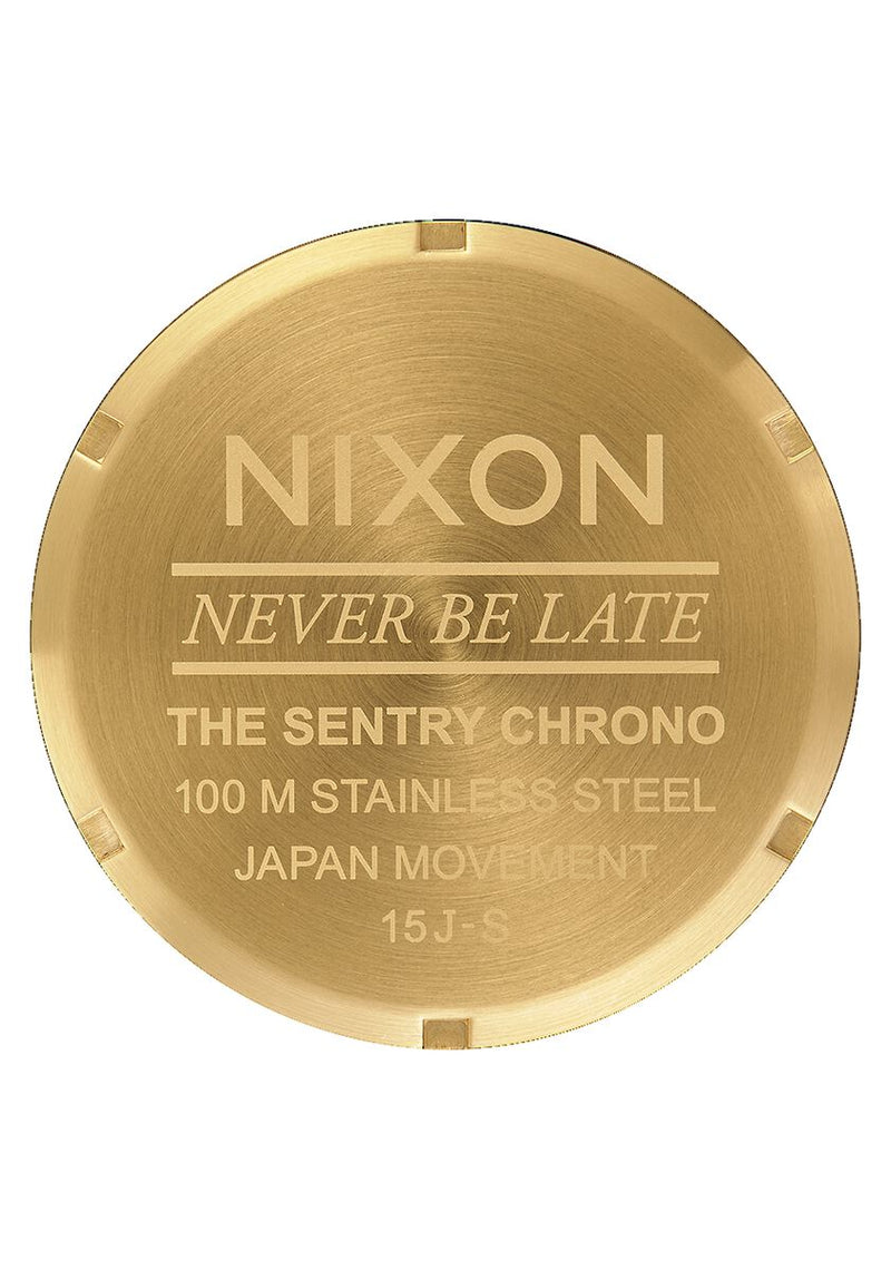 Gold-colored watch caseback with engraved text for a Nixon Sentry Chrono model.