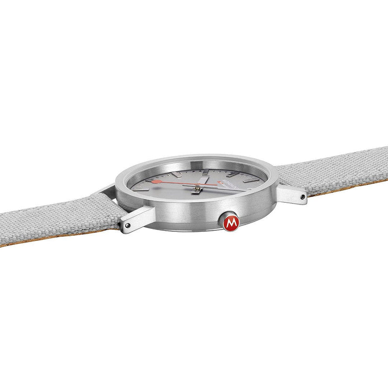 Sleek wristwatch with a silver case and gray leather strap.