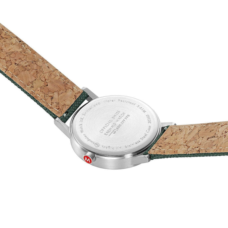 Wristwatch with a cork-textured leather strap and silver case back.