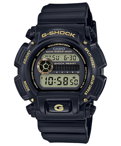 G-Shock digital wristwatch with a black resin band and gold accents.