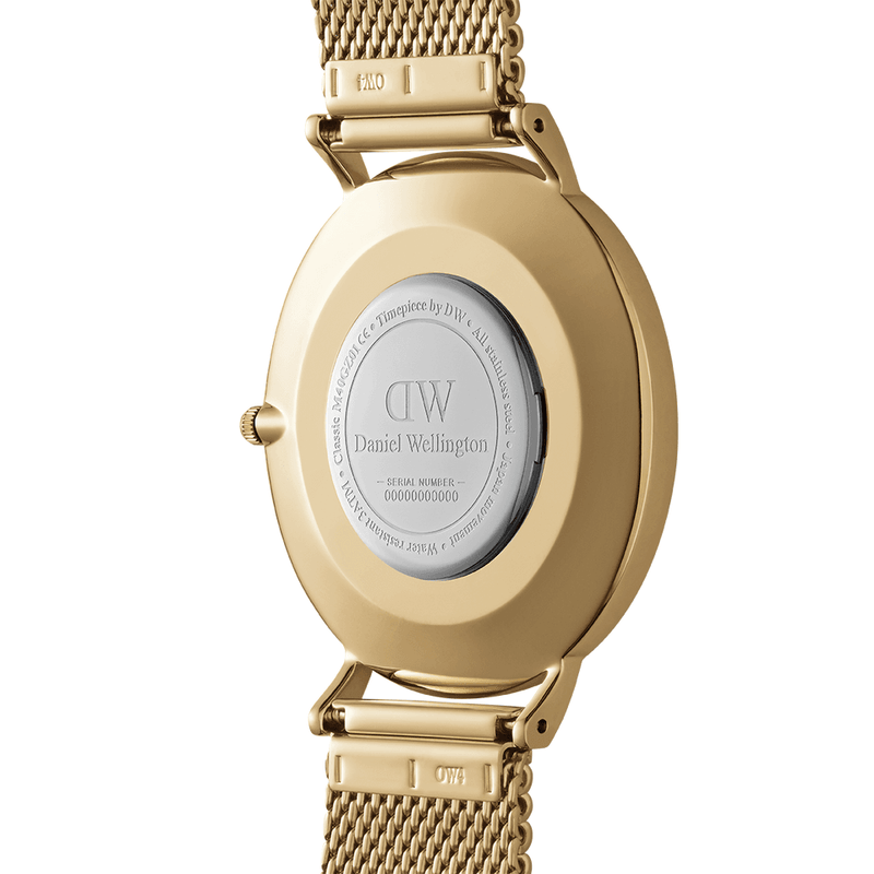 Gold-toned wristwatch with a mesh metal band and circular case back displaying ’Daniel Wellington’ branding.