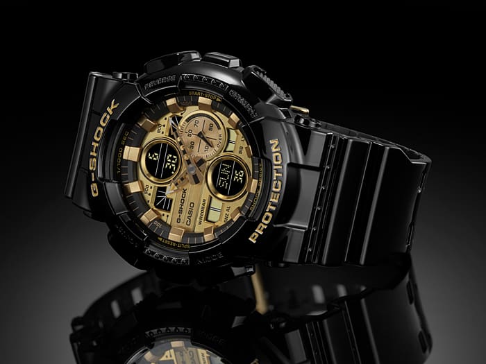 Black and gold G-Shock wristwatch with a digital-analog hybrid display.