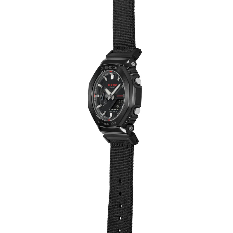 Black wristwatch with a fabric strap and round face.