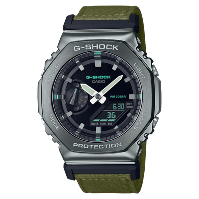 G-Shock watch with a green fabric strap and metallic gray casing.