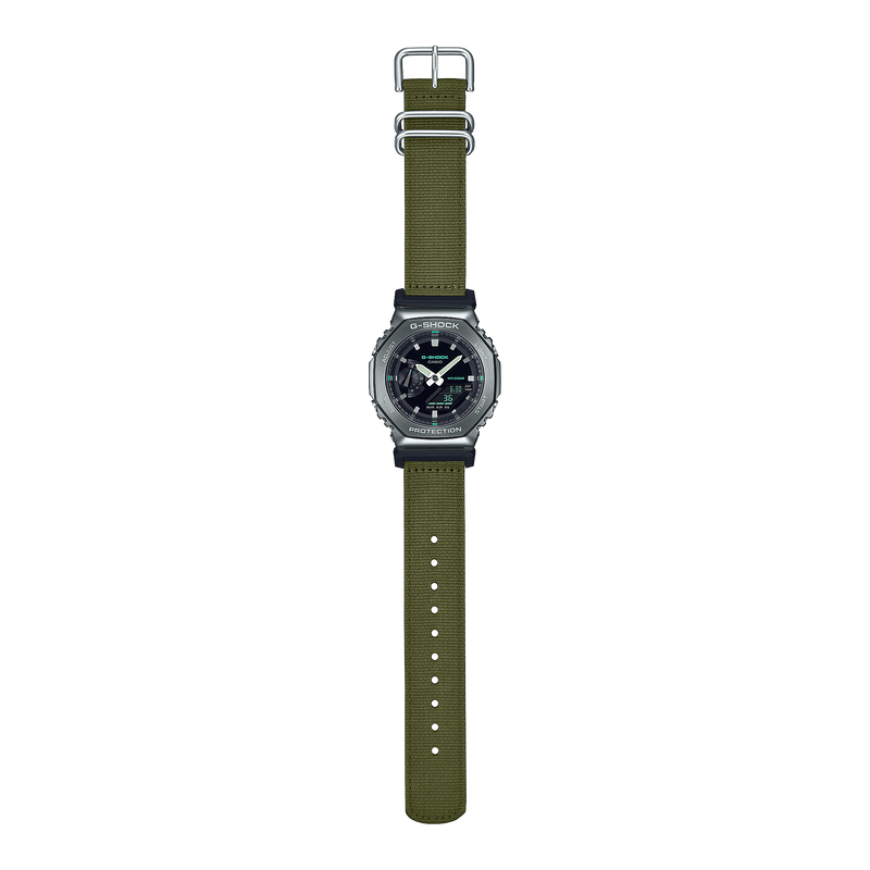 Wristwatch with a green fabric strap and dark circular face.