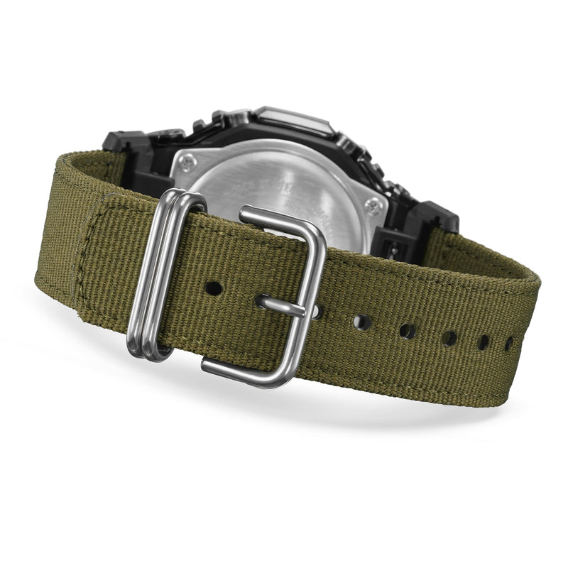 Military-style wristwatch with an olive green canvas strap and silver buckle.