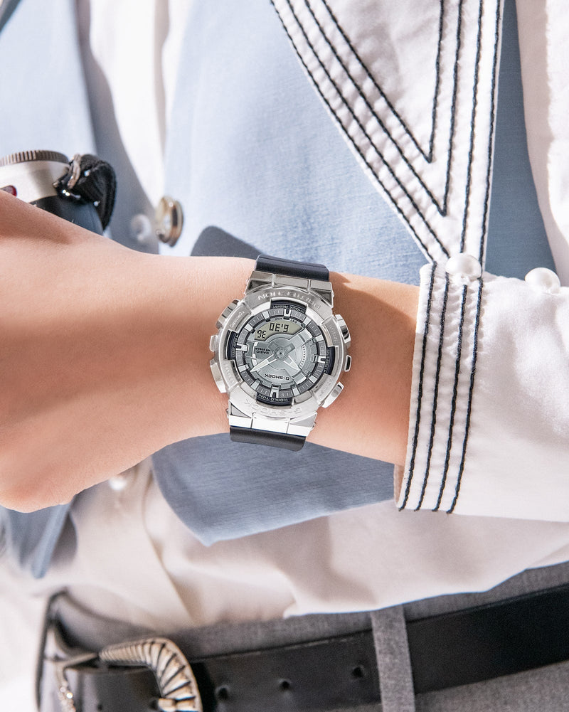 Silver wristwatch with a detailed circular face and metallic band.