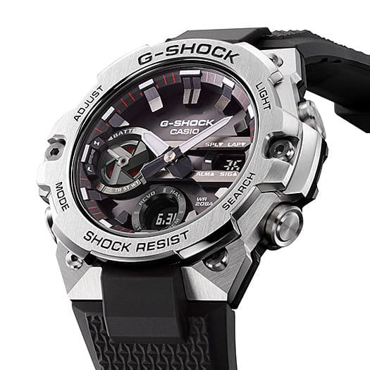 G-Shock watch with a silver case, black dial, and black rubber strap.