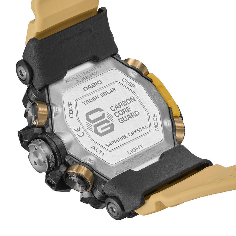 Casio G-Shock watch with a black and gold color scheme, showing its carbon core guard case back.