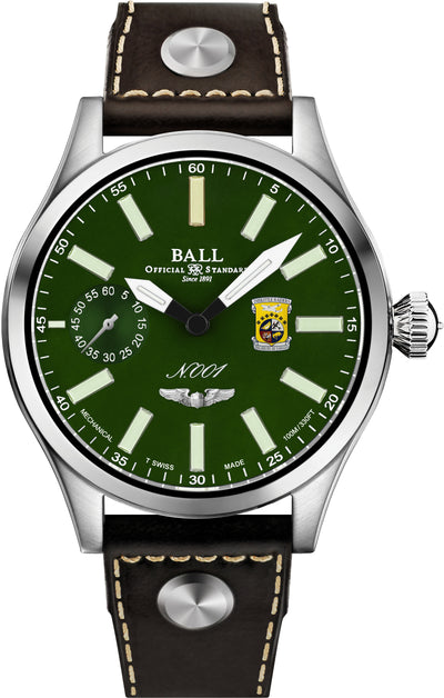 Wristwatch with a green dial and brown leather strap.