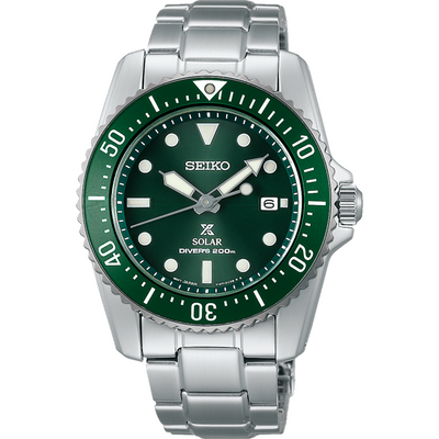 Seiko dive watch with a green dial and bezel on a stainless steel bracelet.