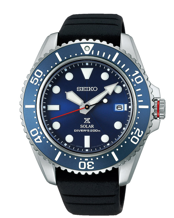 Seiko dive watch with a blue dial and bezel on a black rubber strap.