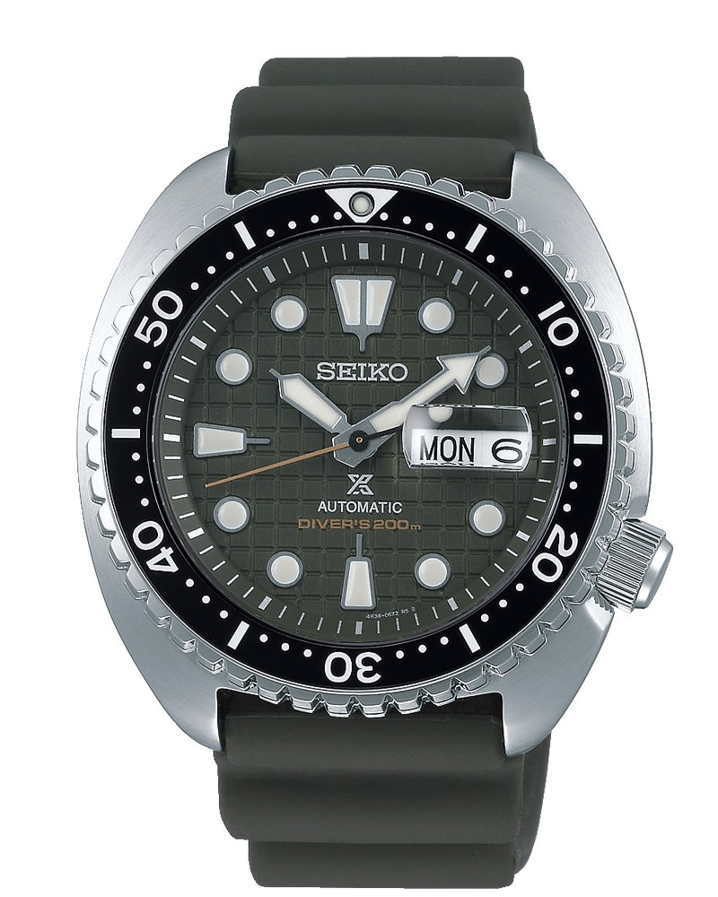 Seiko automatic dive watch with a black dial and rubber strap.