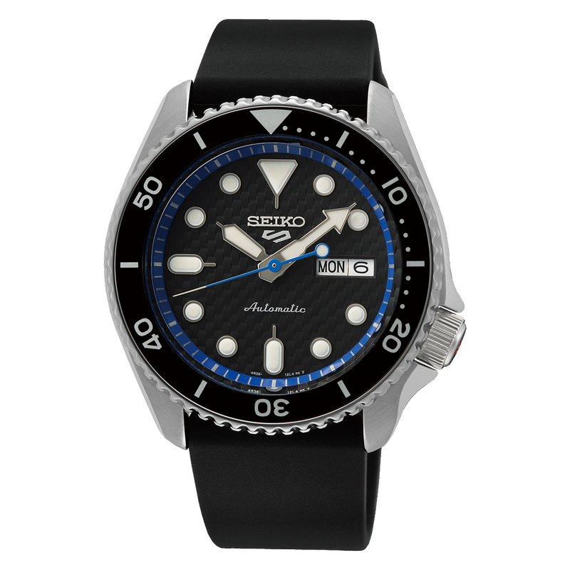 Seiko automatic dive watch with a black bezel and blue accent on the dial.