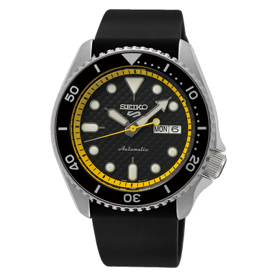 Seiko dive watch with a black dial, yellow inner bezel ring, and rubber strap.