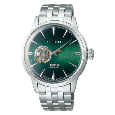 Seiko Presage automatic wristwatch with a green dial and silver metal bracelet.